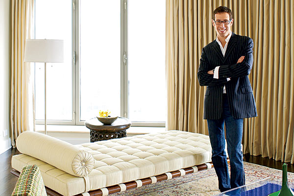 Richman stands alongside his silk-upholstered Mies daybed in the living room.