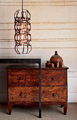 Chandelier, dresser, table and pots collected from around the world