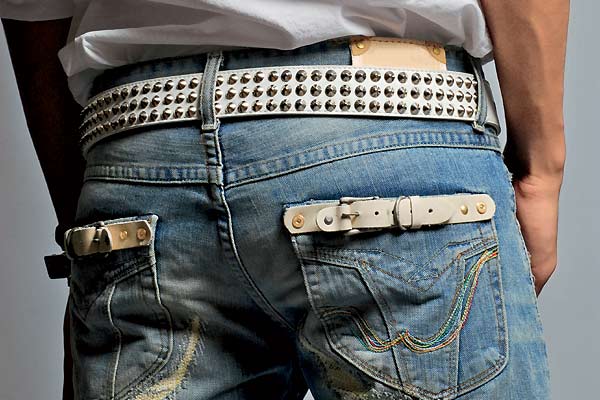Men's jeans should be "medium to dark blue, unembellished, unmarred, hang on your hips, cover your ankles, and extend to at least the top of your shoes. Levi’s 501s always work. End of story," says Ellen Rakieten, co-author of Undateable.