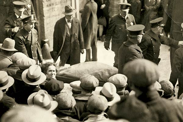 The day after the massacre, a coroner's jury watched police reenact the killings at the scene of the crime. 