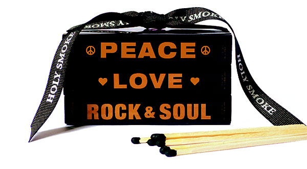 Holy Smoke matchbook with the words 'Peace, Love, Rock & Soul' printed on the box.