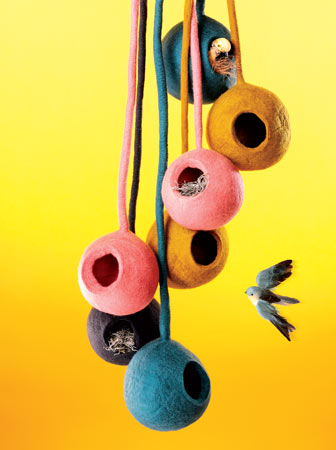Hip, different colored hand-felted bird houses at Sprout Home