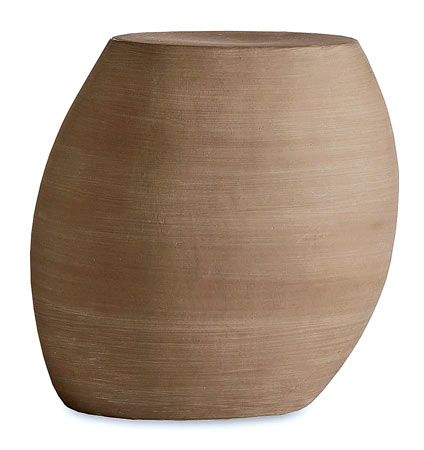 The hollow concrete Pebble side table is easy to move to where the action is, 14 inches high, $150, at West Elm. 