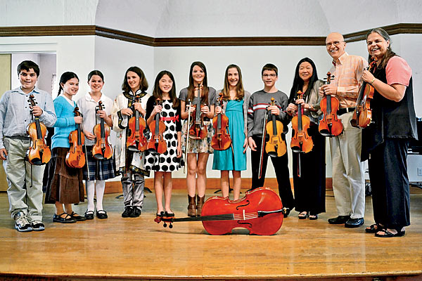 Sue Ann Erb poses with her violin students