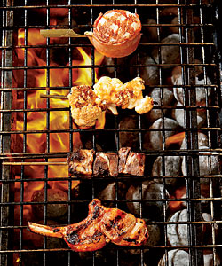 Various meat and seafood prepared on a robata grill