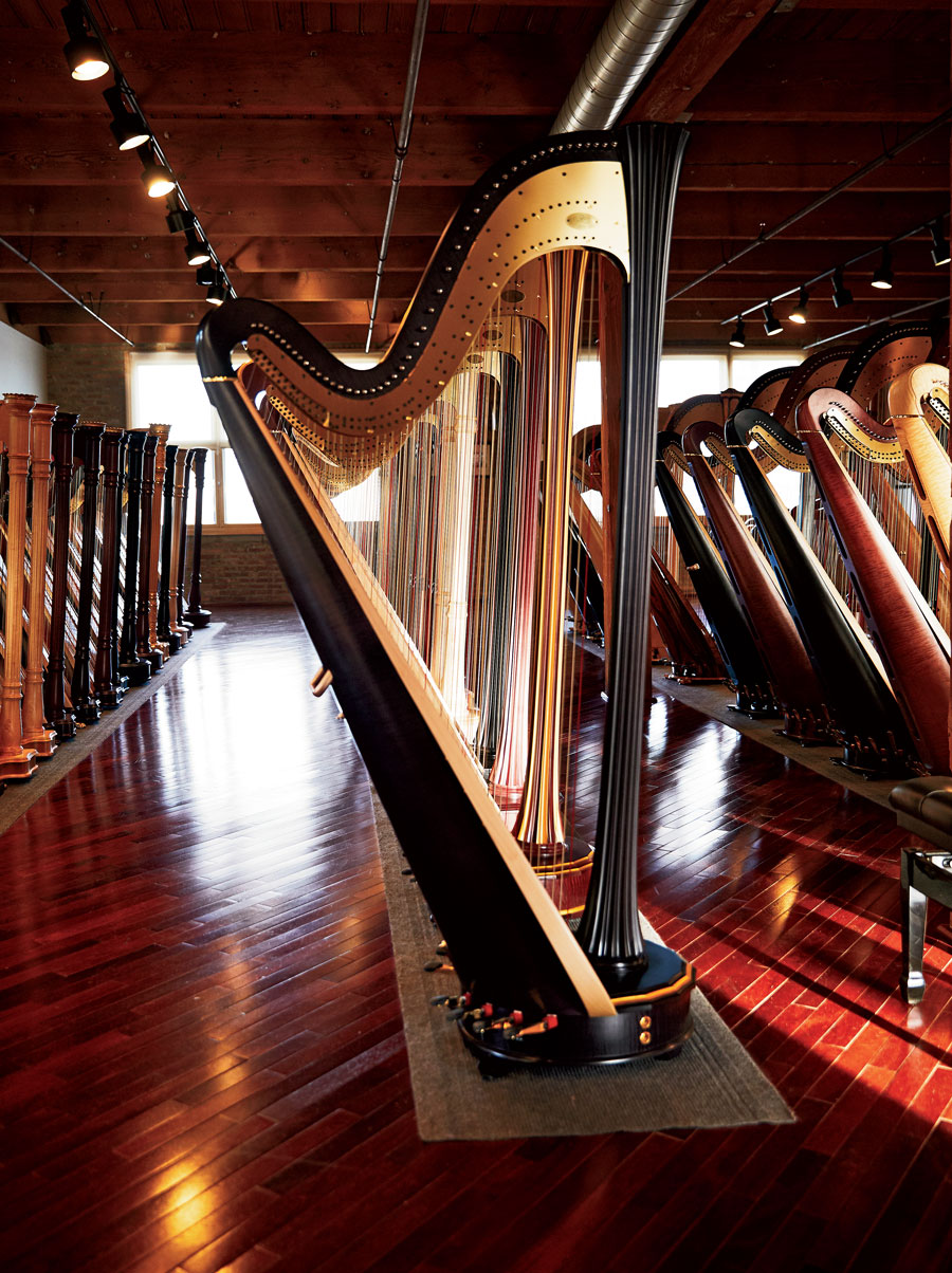 Finished concert grands are displayed in Lyon & Healy’s showroom, where world-famous harpists will try them out.