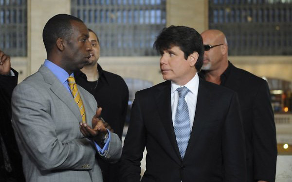 Rod Blagojevich (right) talks to another contestant on The Celebrity Apprentice