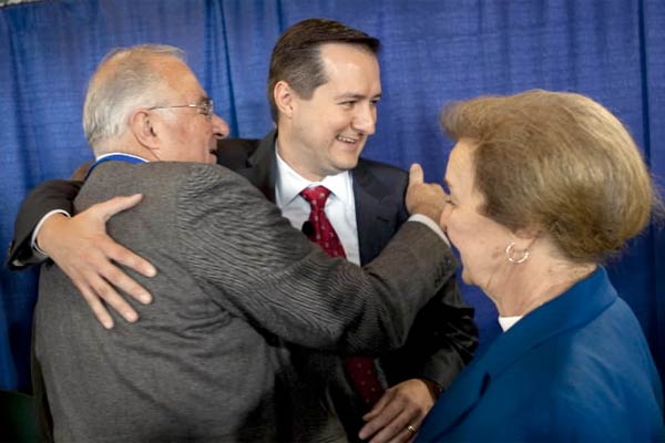 Tom Ricketts gets a hug from his parents Joe and Marlene Ricketts after a press conference after closing the transaction to acquire a 95 percent controlling interest in the Chicago Cubs, Wrigley Field and 25 percent of Comcast Sportsnet on Friday, October 30, 2009. 