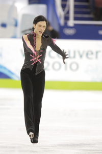 Johnny Weir skates in a pink corseted outfit at the 2010 Vancouver Olympics