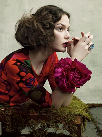 a woman poses in a floral dress from Max-Mara in Chicago