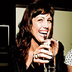 A girl enjoying a drink at Old Oak Tap, a bar in Chicago's West Town neighborhood