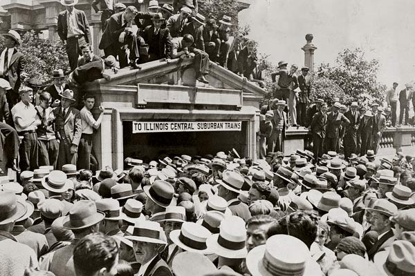 A crowd throngs the entrance to the pedestrian tunnel where the crime occurred.