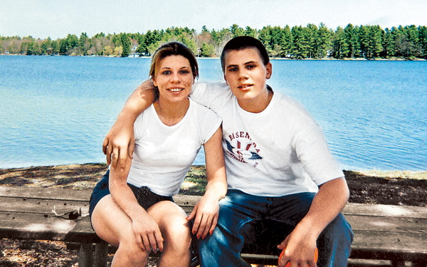 Cathy Reinert, seen in this photo with 14-year-old Michael York, says her son struggled emotionally and academically when he reached adolescence.