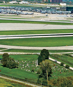 The five-acre St. Johannes cemetery abuts a cargo depot and a taxiway for passenger jets at O'Hare International Airport.