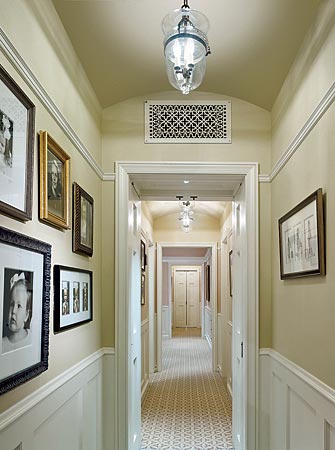 Having the same color on walls and ceiling gives this hallway in a Winnetka home, designed by Gary Beyerl and Kristin Fogarty of Burns & Beyerl, a unified look.