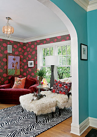 A stationery designer celebrates her love of color and patterns by piling them on in her living room. Why does it work? She basically stuck to four colors—brown, hot pink, black, and white—and from there, had at it with all matter of patterns and textures.