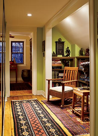 A charming finished attic in Edgewater is brightened with lime green paint, a pleasantly surprising background for Oriental rugs and Mission-style furniture.