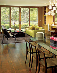 The couple calls this space off the breakfast room their playroom. With its TG Couture sofa, Hans Wegner shell chairs, and Bocci chandelier from Luminaire, it’s an invitingly casual place to relax and enjoy the view.