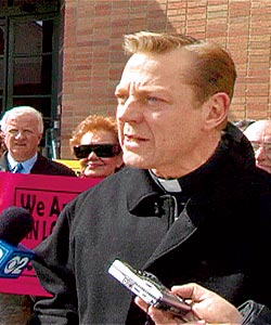 Father Pfleger talks to the media