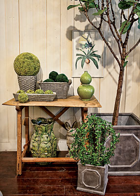 At Mecox, a 19th century Italian crossbase pine table with planters, baskets, and garden ornaments