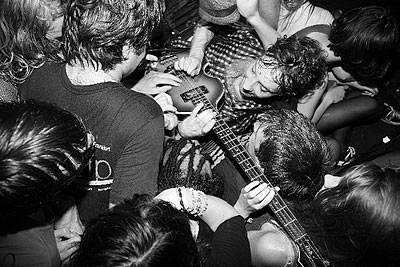 The Black Lips performing surrounded by the crowd