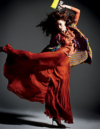 MAXMARA silk blend blouse and palazzo pants, NANETTE LEPORE beaded jacket, JIMMY CHOO clutch, ATELIER SWAROVSKI BY MATTHEW WILLIAMSON necklace, and BRUNO FRISONI shoes