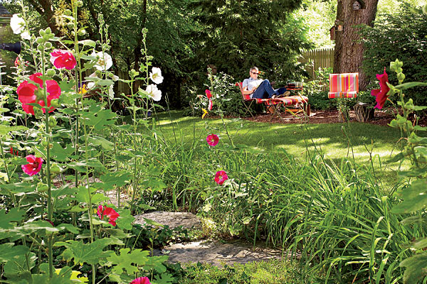 Roger Boike relaxes in his yard.