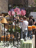 American flags, furniture, and other items for sale at the Vintage Pine flea market