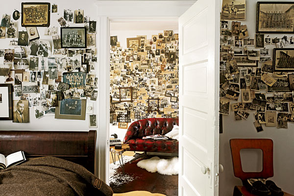 Arrangements of black-and-white photos in the bedroom and living room.