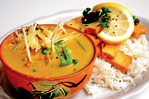 Thai curry with potatoes, carrots, apples, broccoli, and zucchini