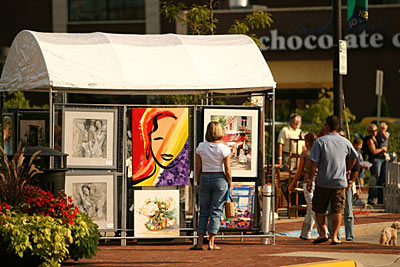 Display of local artists' work at an outdoor fair