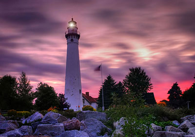 Sunset behind a lighthouse