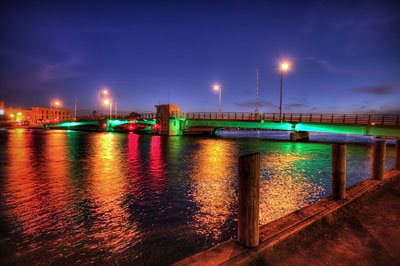 A colorful nighttime view of a bridge in Oshkosh, Wisconsin