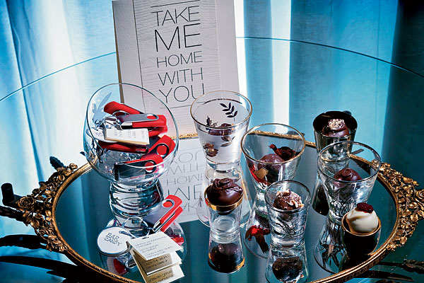 Parting gifts for guests: truffles in shot glasses and flash drives loaded with music from the evening.