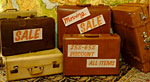Sale signs on vintage suitcases
