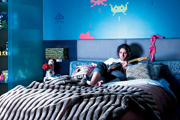 Guitarist Joe Trohman relaxing in his bedroom