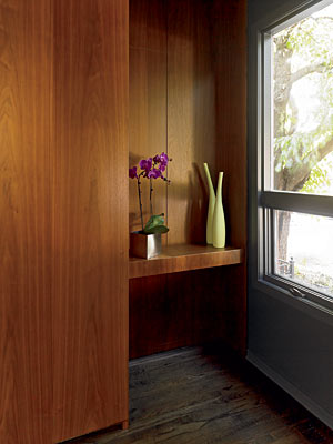 A wall of wood cabinetry near the entrance