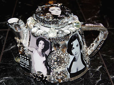 An ornate teapot, decorated with various pictures of Elizabeth Taylor