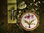 A place setting decorated with foliage