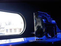 The cash register, accented by moody blue lighting