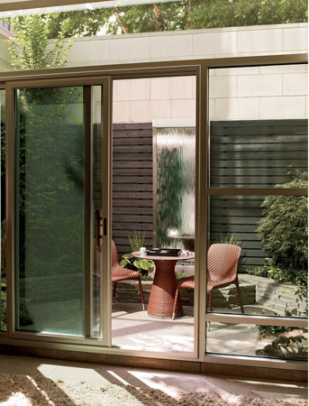 A cedar-slat scrim and a waterfall in the ground-level front courtyard