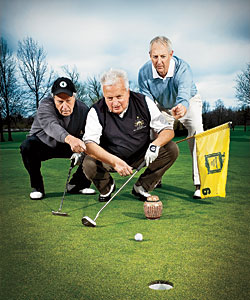 (From left) Jim Thompson, Vic Zast, and Dan Johnson—with their late pal Mike Allen (in urn)—gear up for tee time in the Arctic Circle.