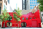 The bright red storefront of Ikram Goldman's boutique in River North