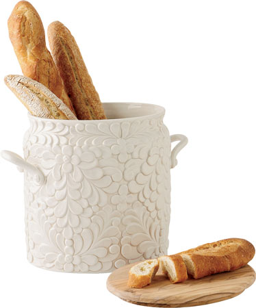 Store-and-serve ceramic bread bin from Verdant has an olivewood lid that doubles as a cutting board