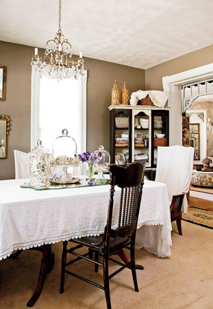 The chandelier in this suburban Chicago dining room shows that a little glitter can have a place in prairie style 