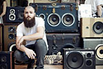 A man surrounded by Gentleman's Boomboxes by Floyd A. Davis