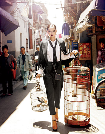 THE ROW jacket, blouse, and pants, SACHIN + BABI earrings, MICHAEL KORS bag, and JIMMY CHOO booties