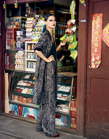 MICHAEL KORS body suit, trousers, belt, and balmacaan, OBJETS D’ENVY earrings, and BRIAN ATWOOD shoes