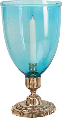 Blue glass hurricane lamp with silver base, $4,600 for a set of two, at Maze Home.