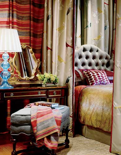 Tony Stavish draped the walls and windows in this room with kilimesque striped cotton by Andrew Martin for Lee Jofa and played off its colors when choosing other fabrics.